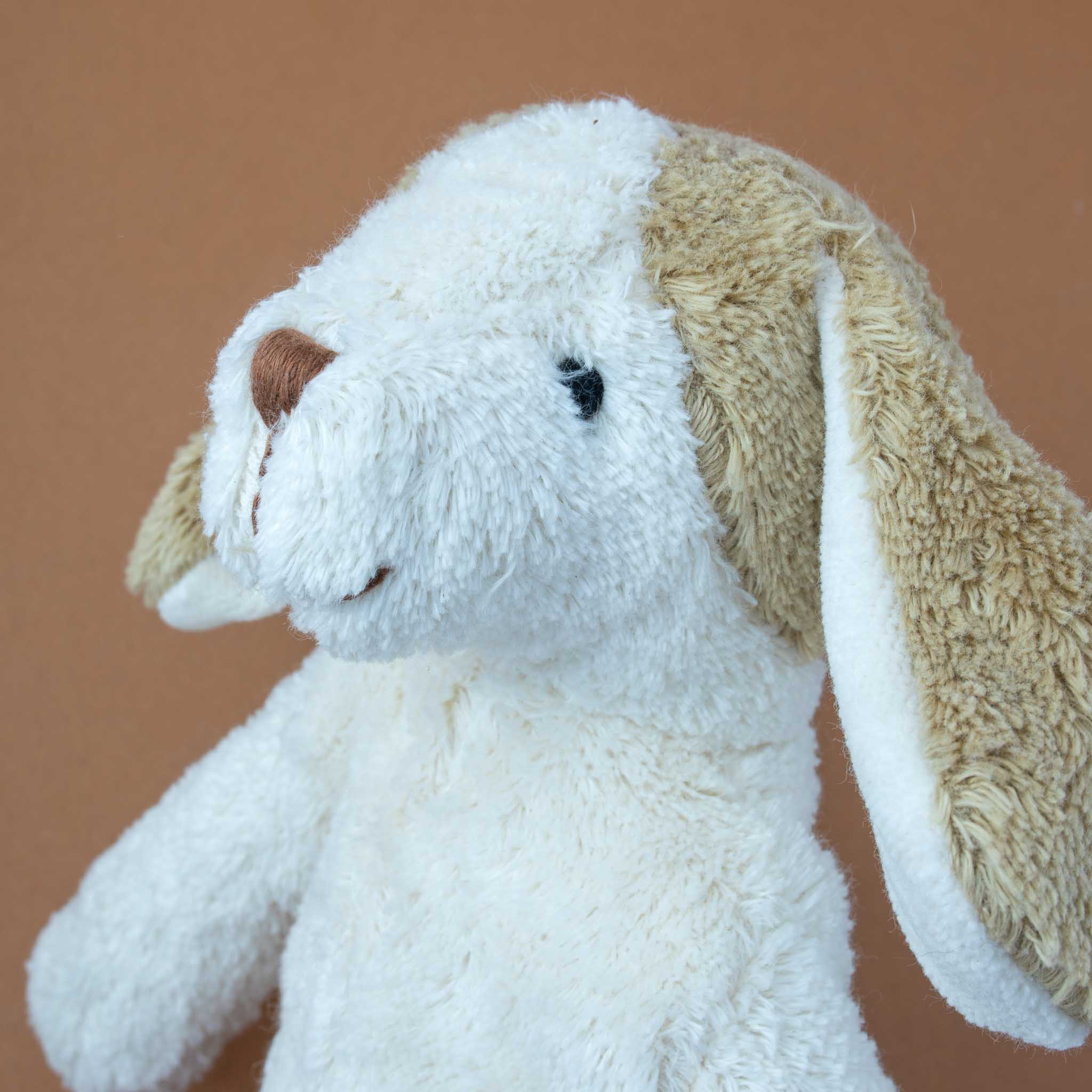 close-up-of-stitched-face-and-brown-ears