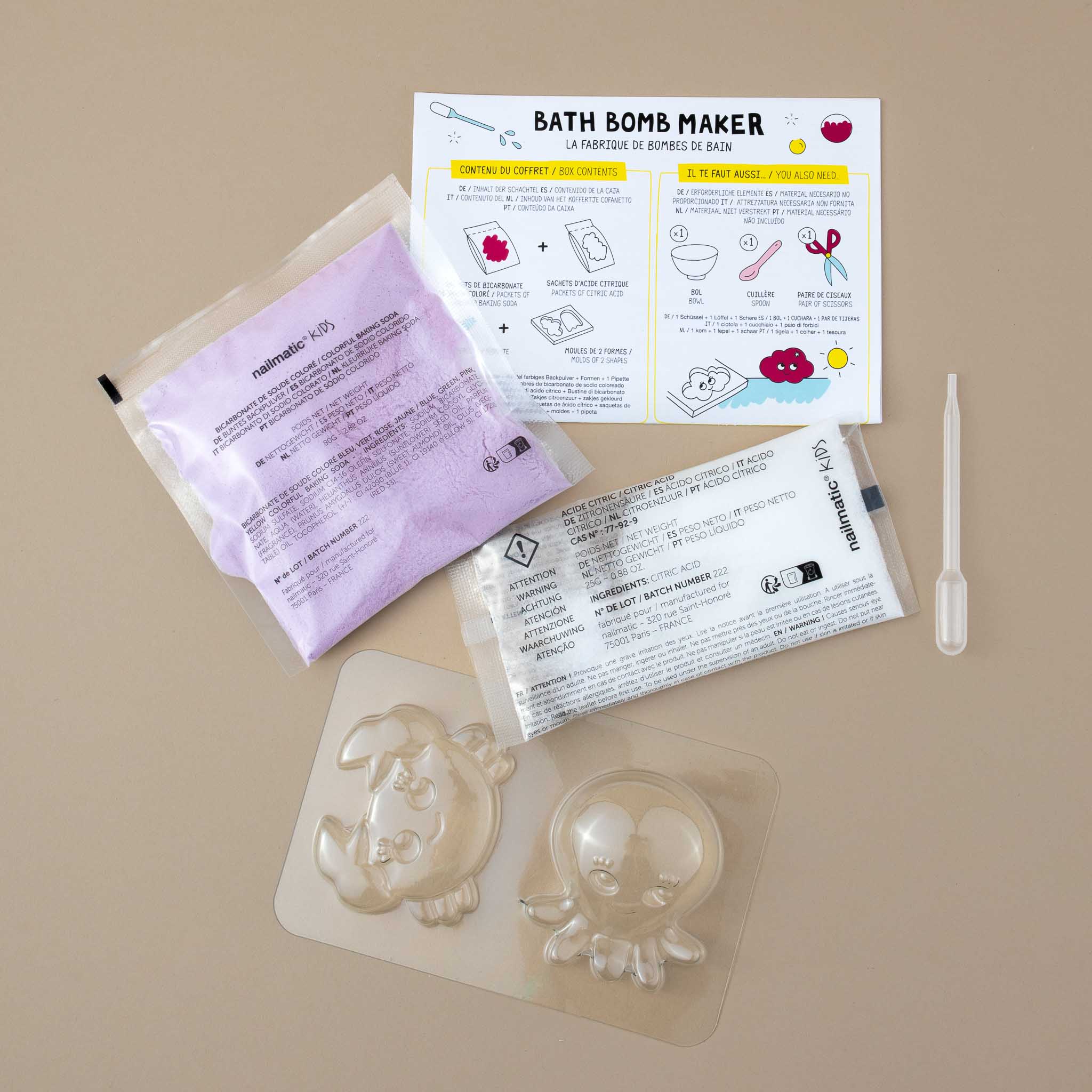 content-of-package-showing-two-bags-of-white-and-purple-powders-one-instruction-sheet-one-pipette-and-crab-and-octopus-mold