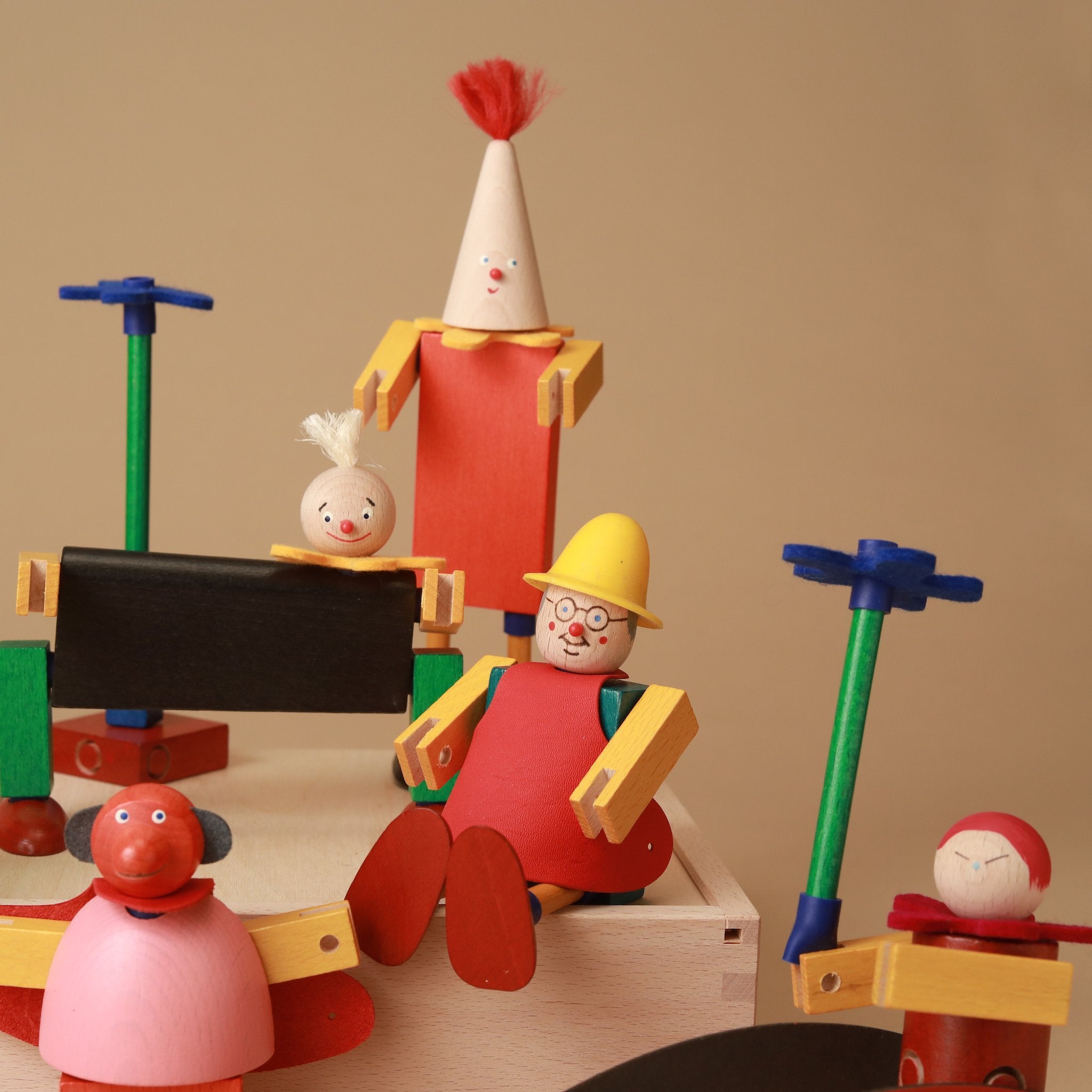 close-up-colorful-wooden-building-figures-schrills-steck-figure