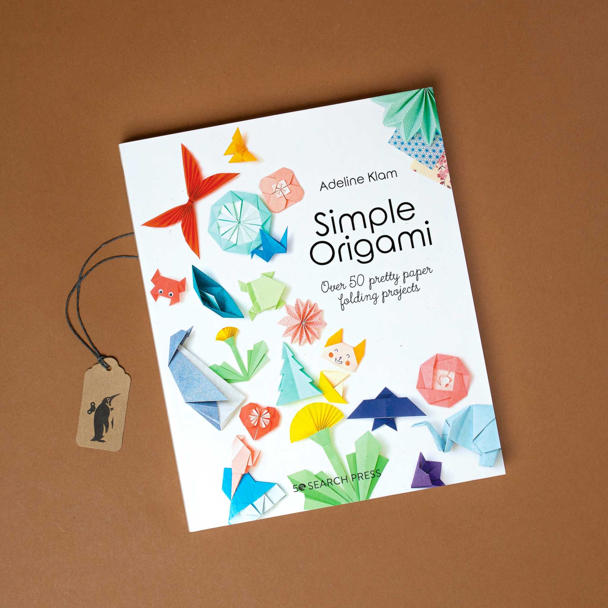 white-book-cover-showing-colorful-origami-projects-like-crab-ship-cat-bird-heart