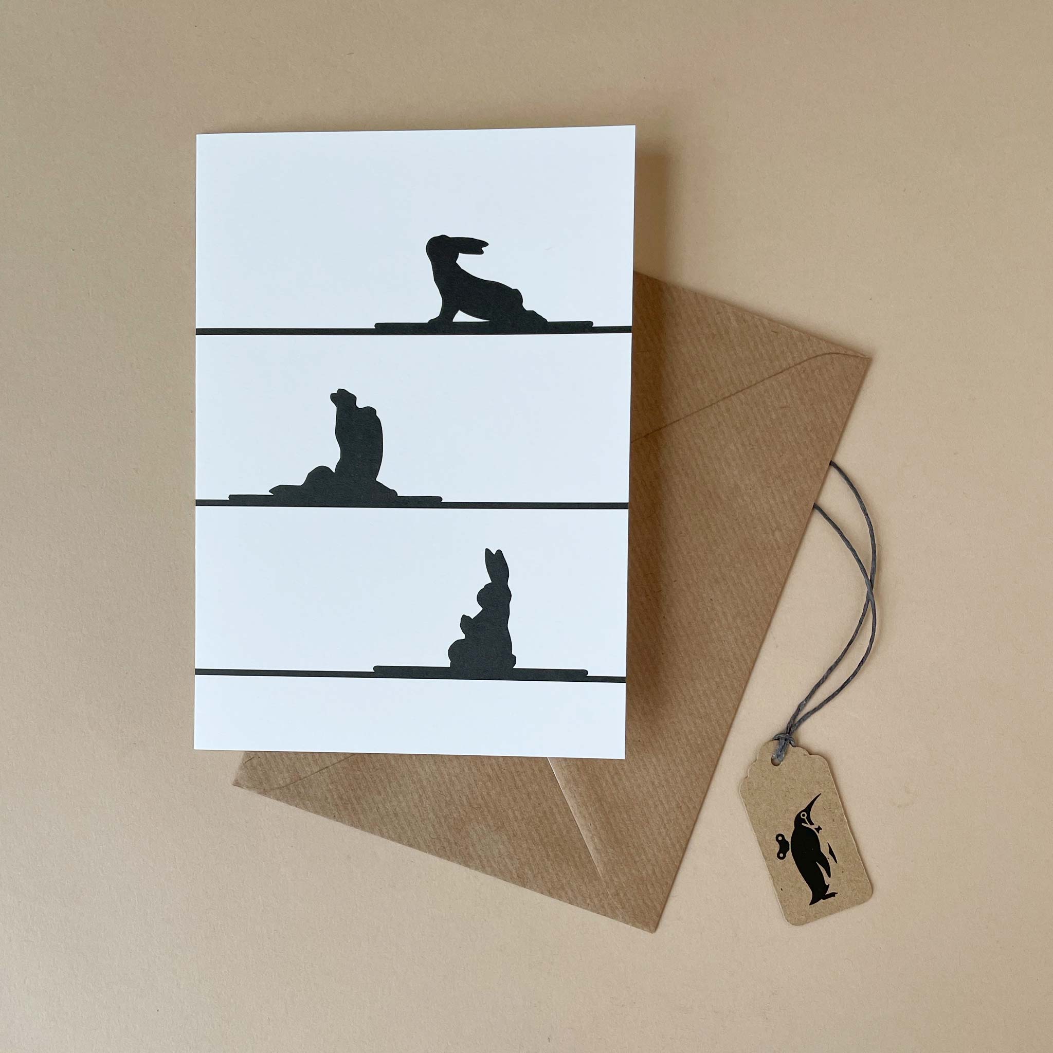 yoga-rabbit-greeting-card-rabbits-sillohuette-in-yoga-poses-and-brown-envelope