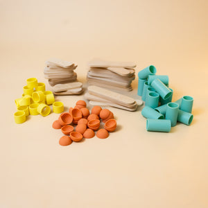 sorted-pieces-wood-sticks-aqua-tubes-orange-cups-and-yellow-short-tubes
