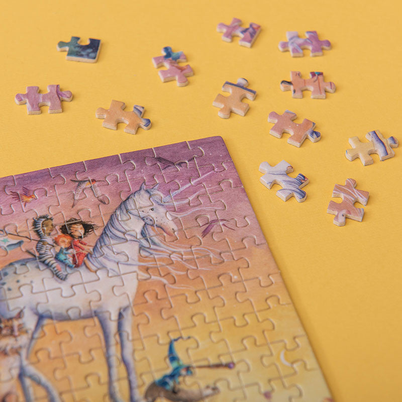 150-piece-micro-puzzle-my-unicorn Unfinished puzzle with a  unicorn and rider illustration on a yellow background
