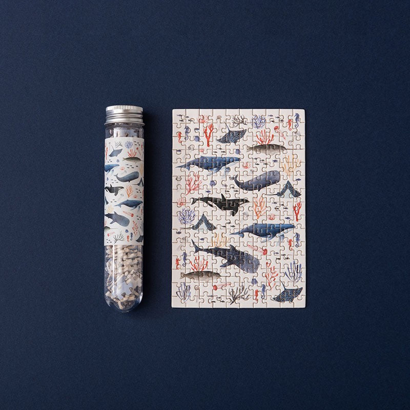 150-piece-micro-puzzle-whales with whale design on a blue background