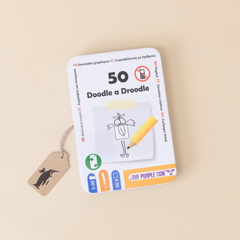 A metal tin of 50-ways-doodle-a-droodle drawing cards by The Purple Cow, displayed on a warm beige background with a small kraft paper tag attached.