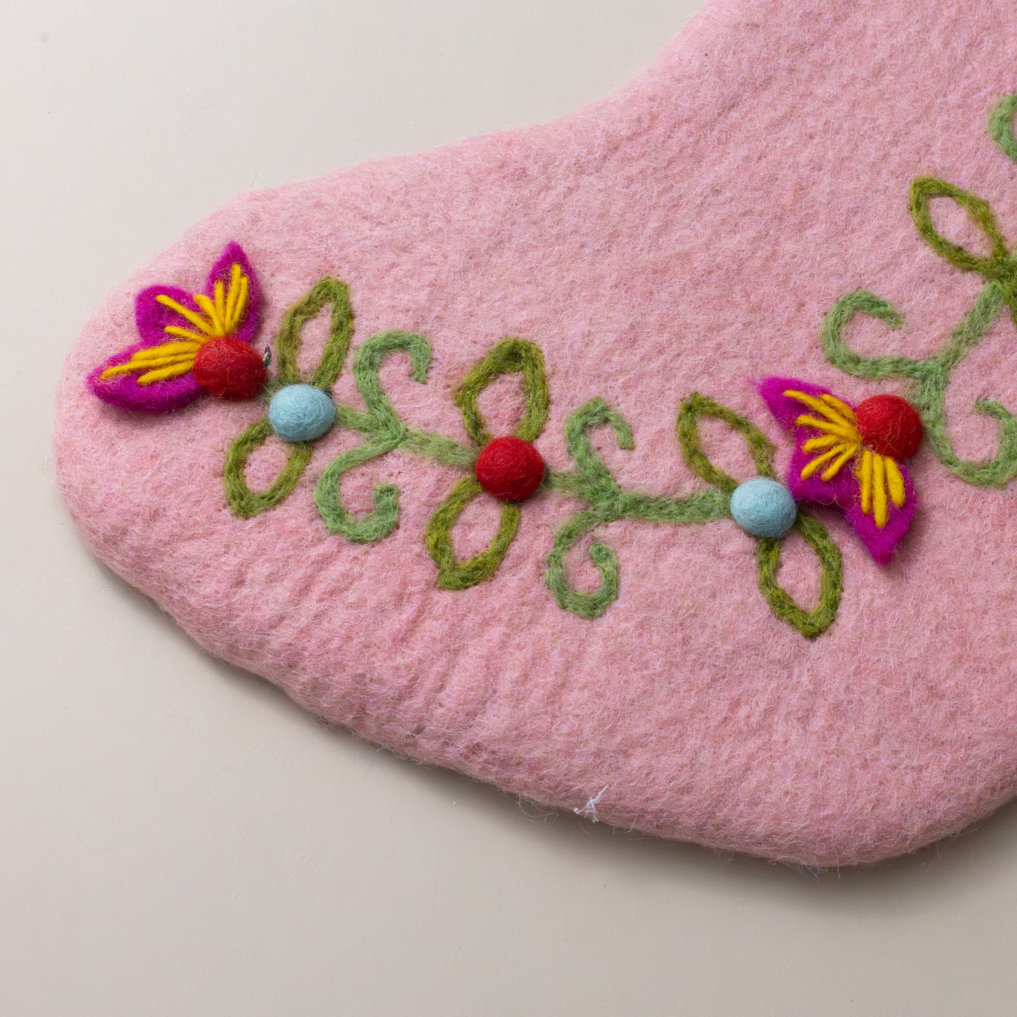 Felted-Meadow-Stocking-Blush-with-green-pink-yellow-and-blue-embroidered-detailed