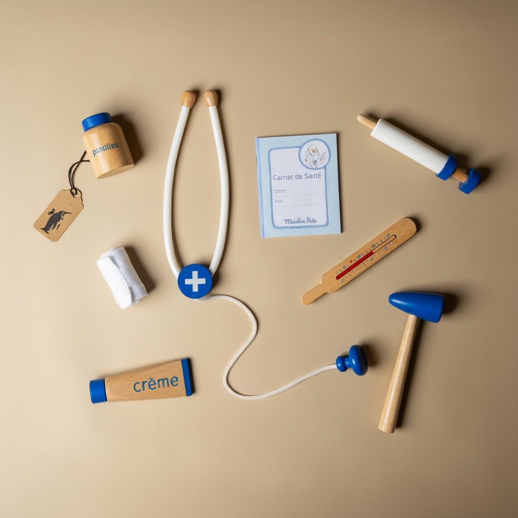 La-Grande-Famille-Doctor-Valise Collection of wooden toys resembling medical supplies on a beige background