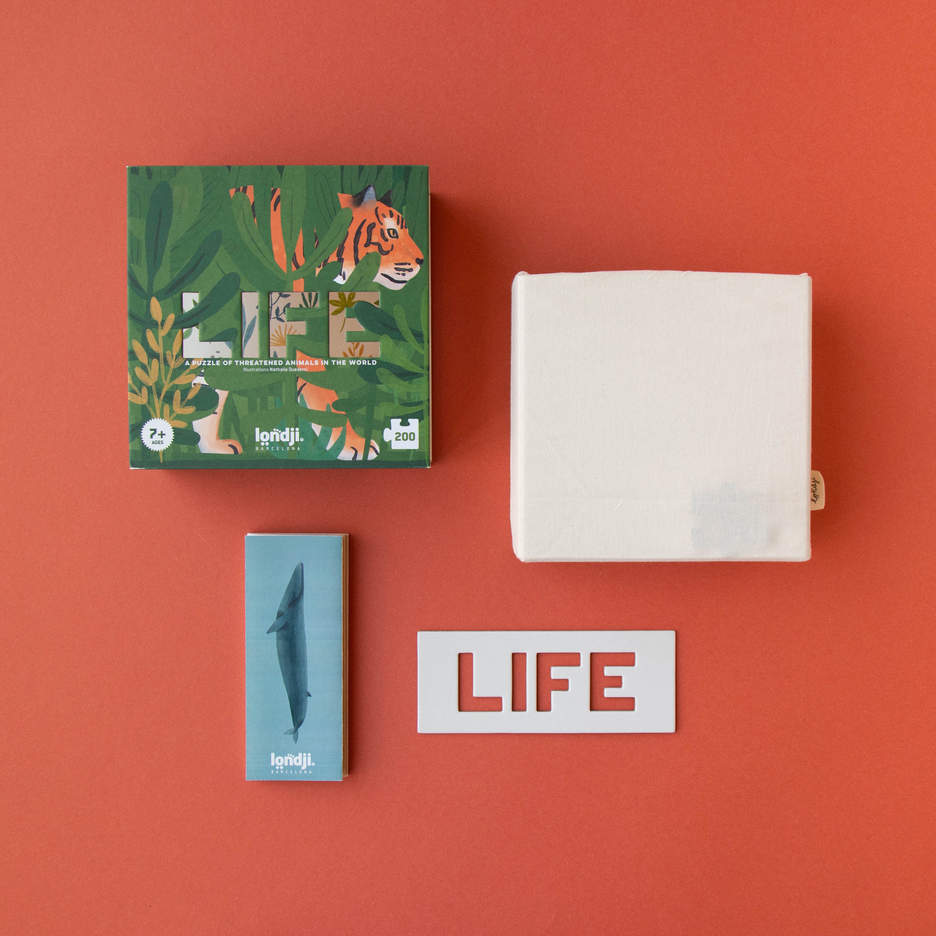 200-piece-life-puzzle  of 'LIFE' branded products on a red background