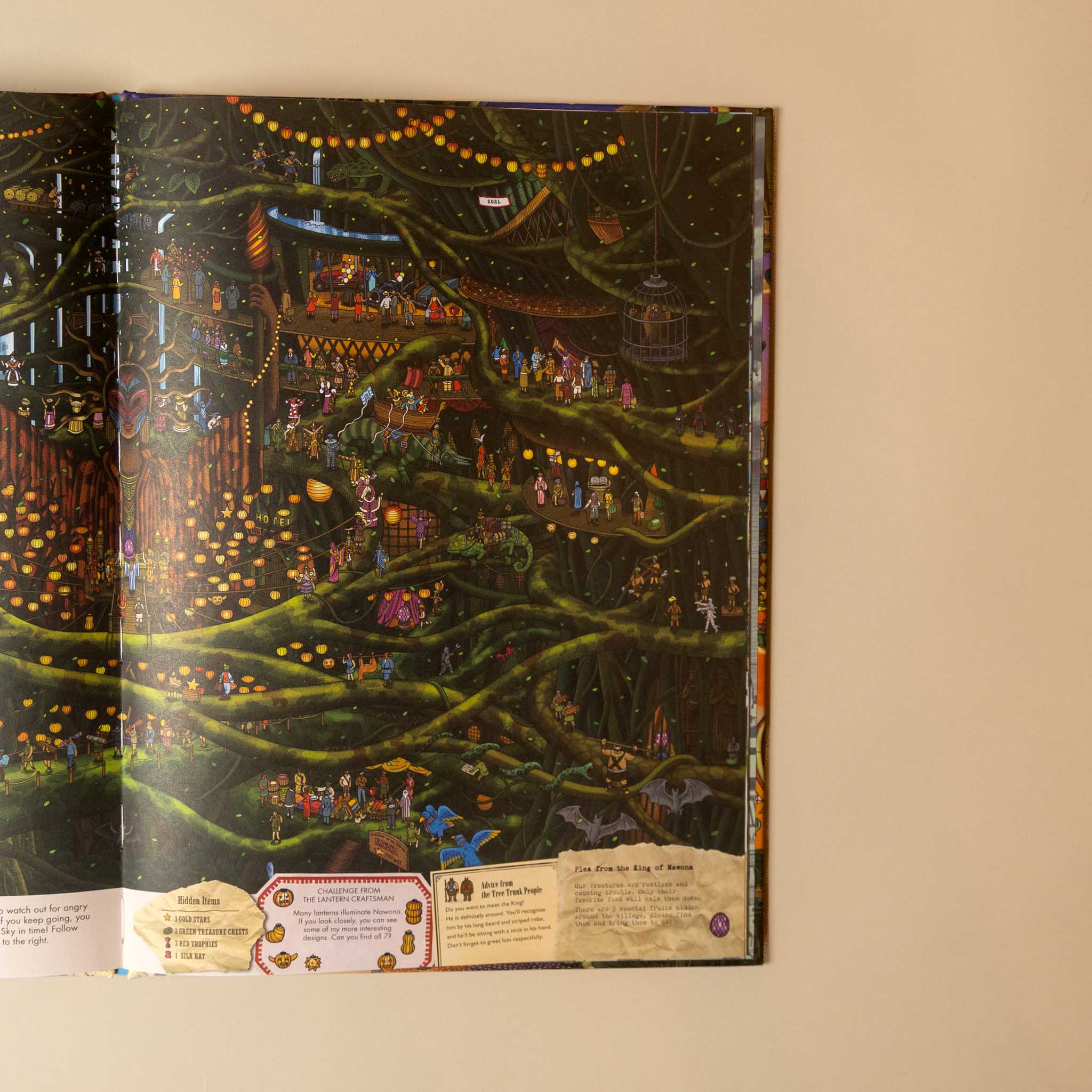 An open illustrated book or art print displayed against a beige wall, showing a highly detailed fantasy forest scene with glowing trees, small figures, and decorative labels along the bottom.