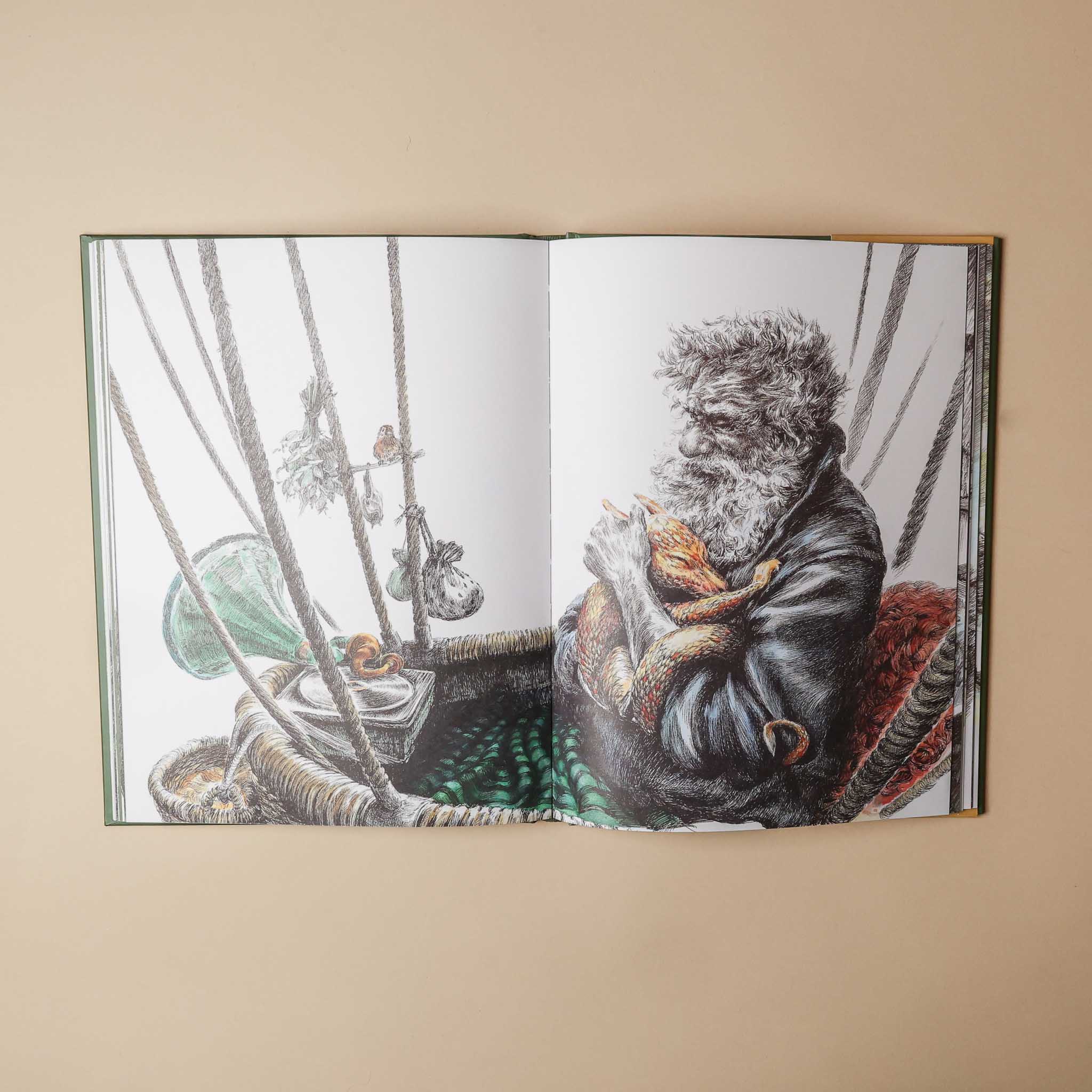 Open the-storytellers-almanac book showing illustrations of a character on a ship with a fox