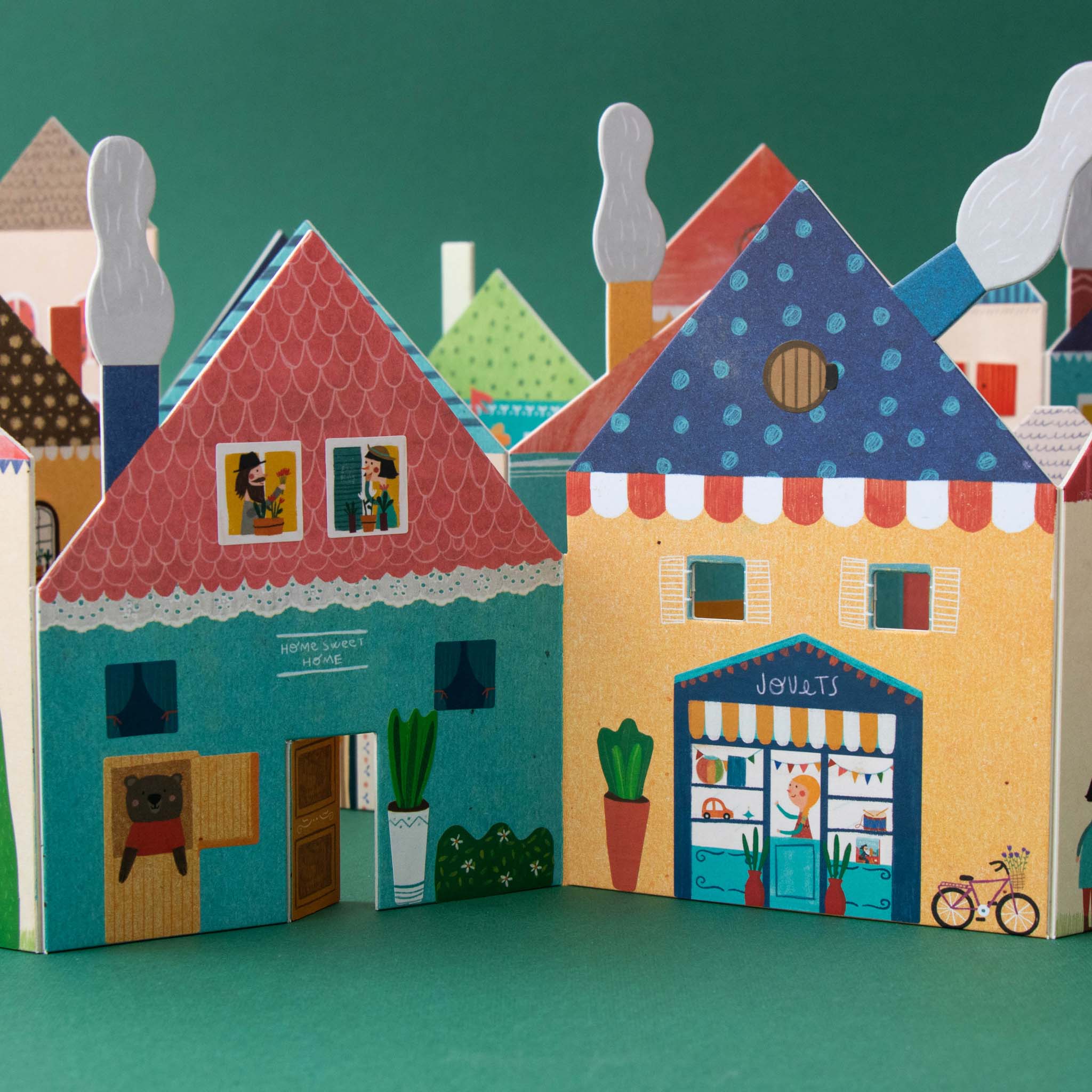 chez-moi-sticker-activity-set-with-store-fronts-windows-doors-roofs-all-standing-up-to-make-a-village