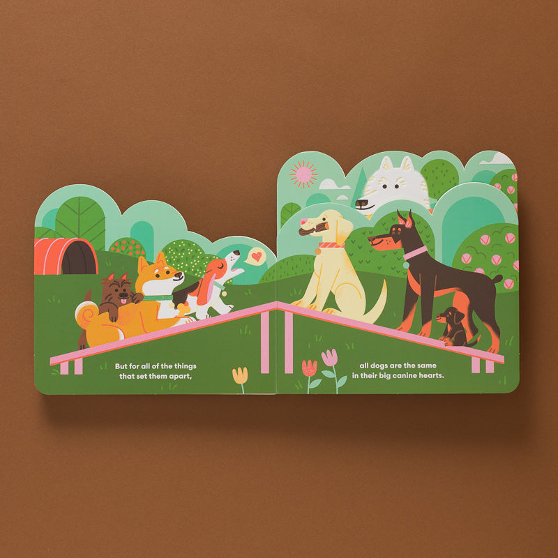 Some-Dogs-Layered-Board-Book open to illustration sof different dogs on a platform