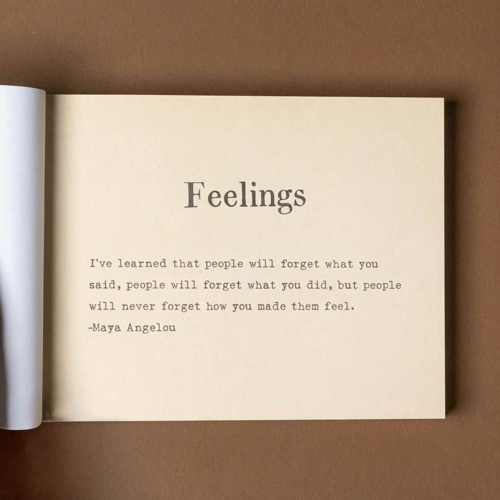 Open book with text about feelings on a brown background