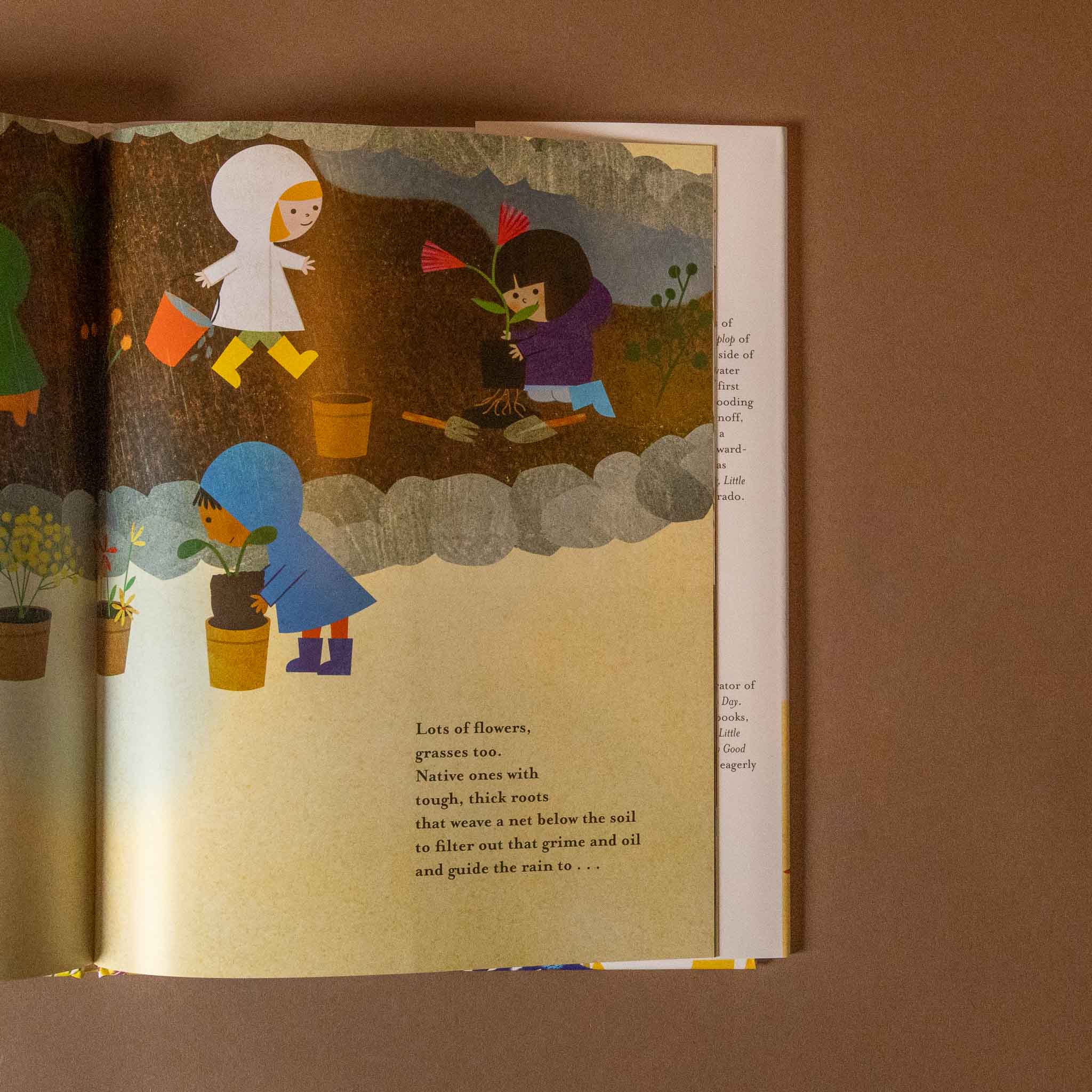 Illustrated a-place-for-rain book open to a page with children gardening