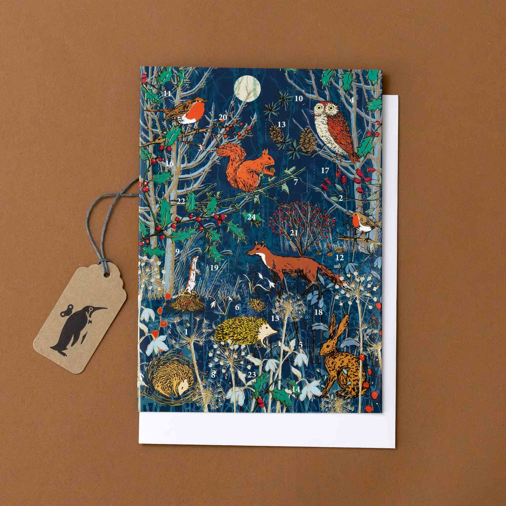 advent-calendar-greeting-card-a-winters-tale-with-fox-squirrel-hedgehog-robin-and-forest-foliage-on-navy-blue-background-with-moon