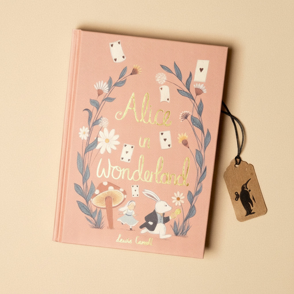 Book titled 'Alice in Wonderland' with illustrations and a tag on a beige background