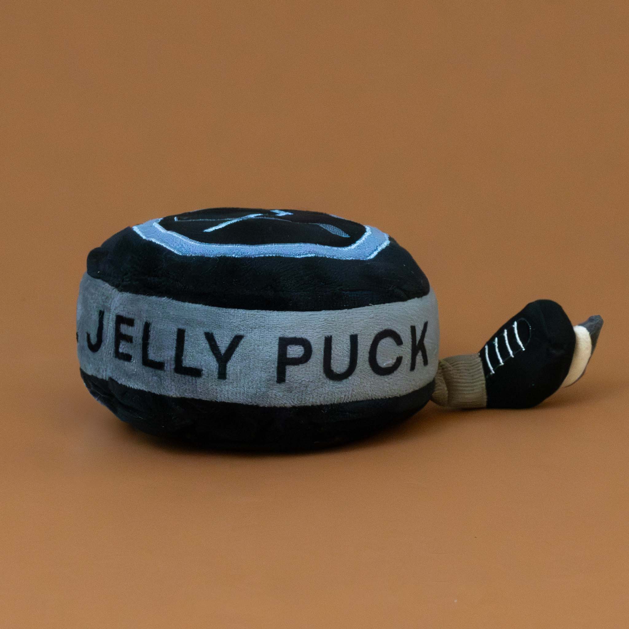 amuseable-sports-ice-hockey-puck-black-and-grey-with-ice-skate-feet-stuffed-toy-the-words-jelly-puck-on-the-side