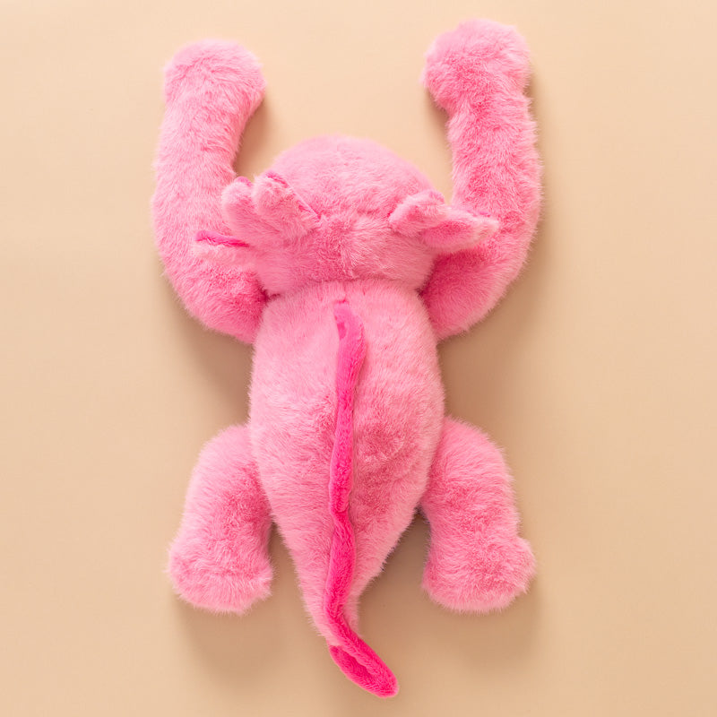 A pink andy-the-axolotyl-kiddo plush toy with a fuzzy, soft texture, featuring small black bead eyes back