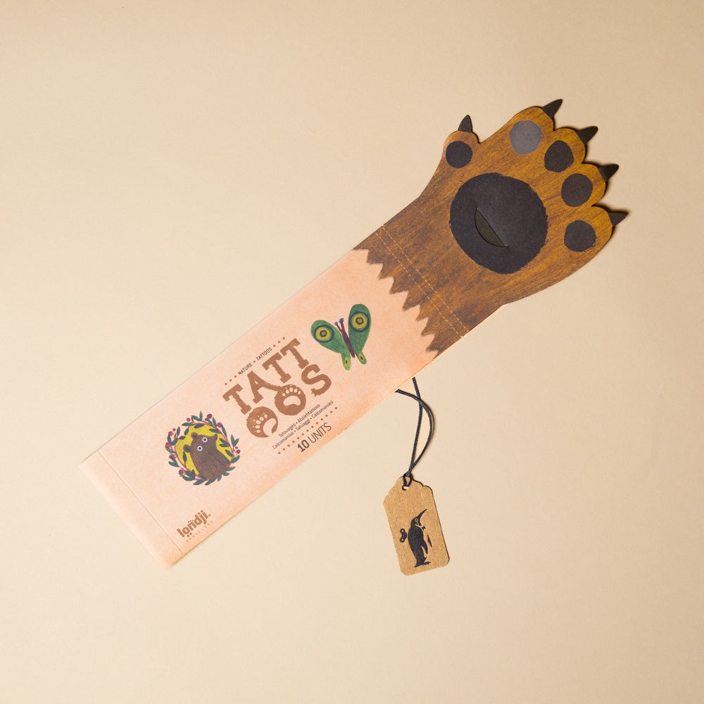 Paw-shaped product armful-of-tattoos-nature on a beige background