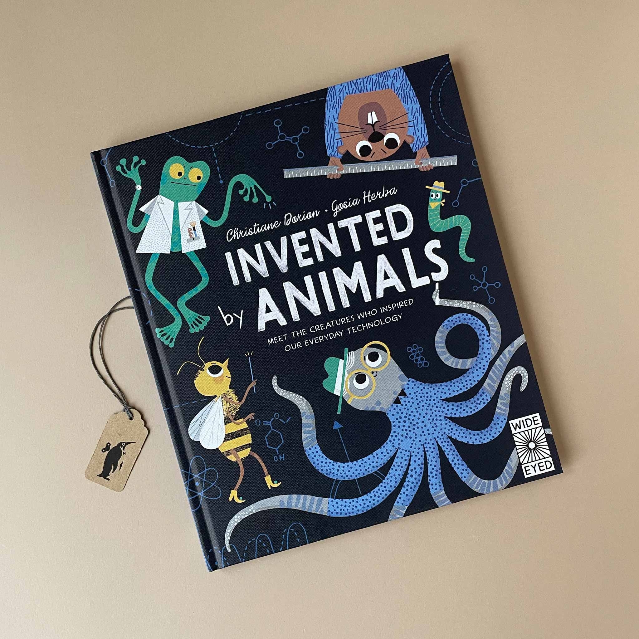 Book titled 'Invented Animals' with illustrations of invented animals on a beige background