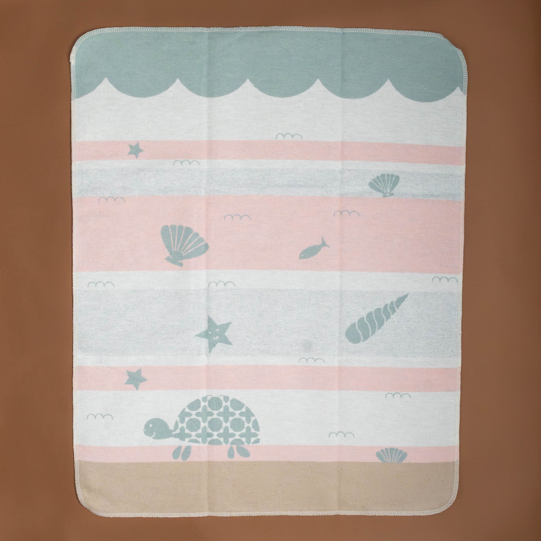 baby-blanket-pink-sage-white-sand-stripes-with-sage-turtle-seashells-fish-starfish-in-ocean-water-with-waves-and-sand-floor