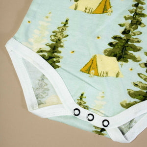 detail-showing-tent-and-trees-on-light-blue-background