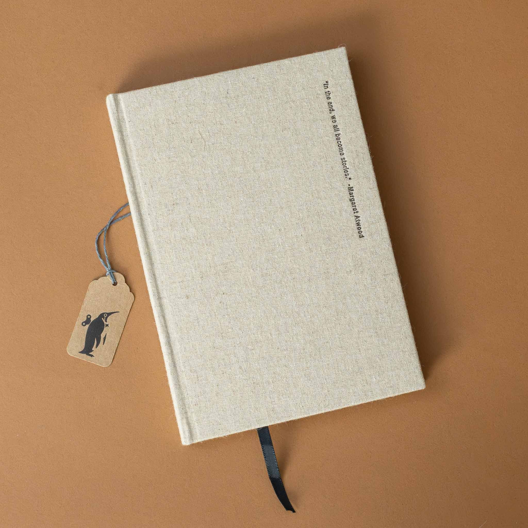 beige-linen-notebook-we-all-become-stories-cover