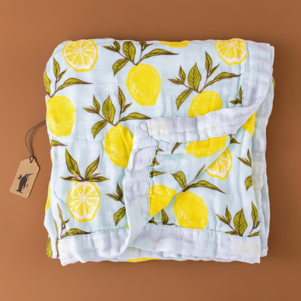 big-lovie-lemons-blanket-with-yellow-lemons-and-green-leafs-on-a-light-blue-background