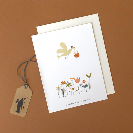 flying-birdie-basket-greeting-card-anoucing-a-little-one-is-coming-over-a-field-of-flowers