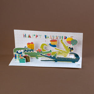 interior-of-card-showing-pop-up-alligators-dressed-for-a-party