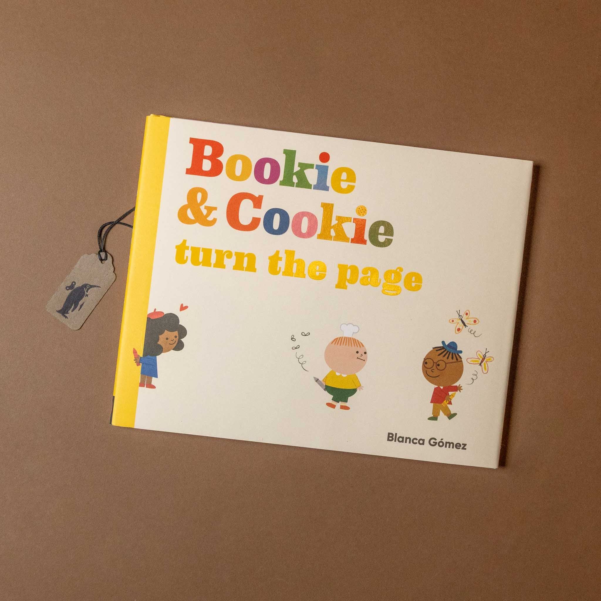 Children's book titled 'Bookie & Cookie turn the page' by Blanca Gomez on a brown background