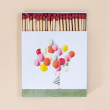 Load image into Gallery viewer, box-full-of-matches-balloon-bunch-held-by-women-in-striped-dress-with-red-tipped-matches