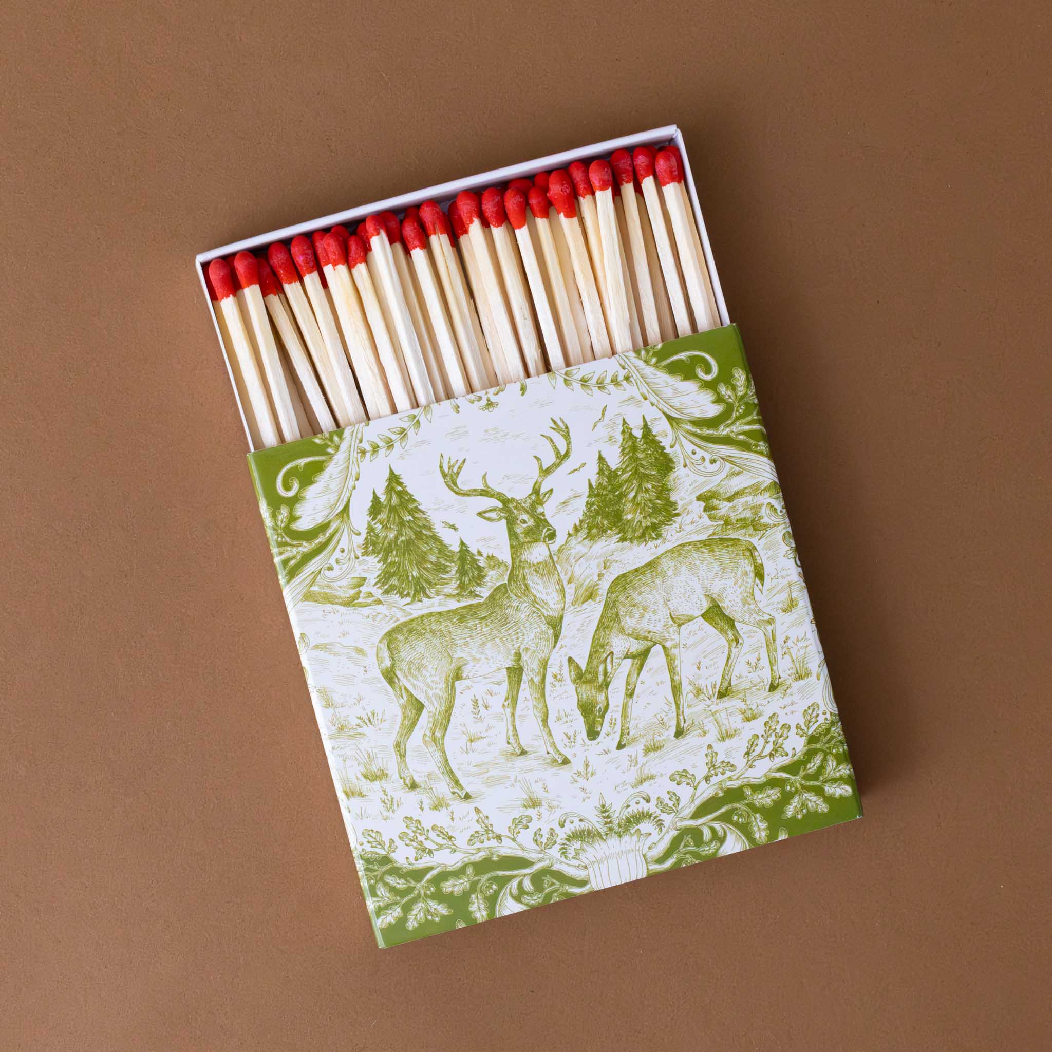 box-full-of-red-tipped-matches-fable-fauna-green-and-white-image-of-a-stag-and-a-doe-in-a-field