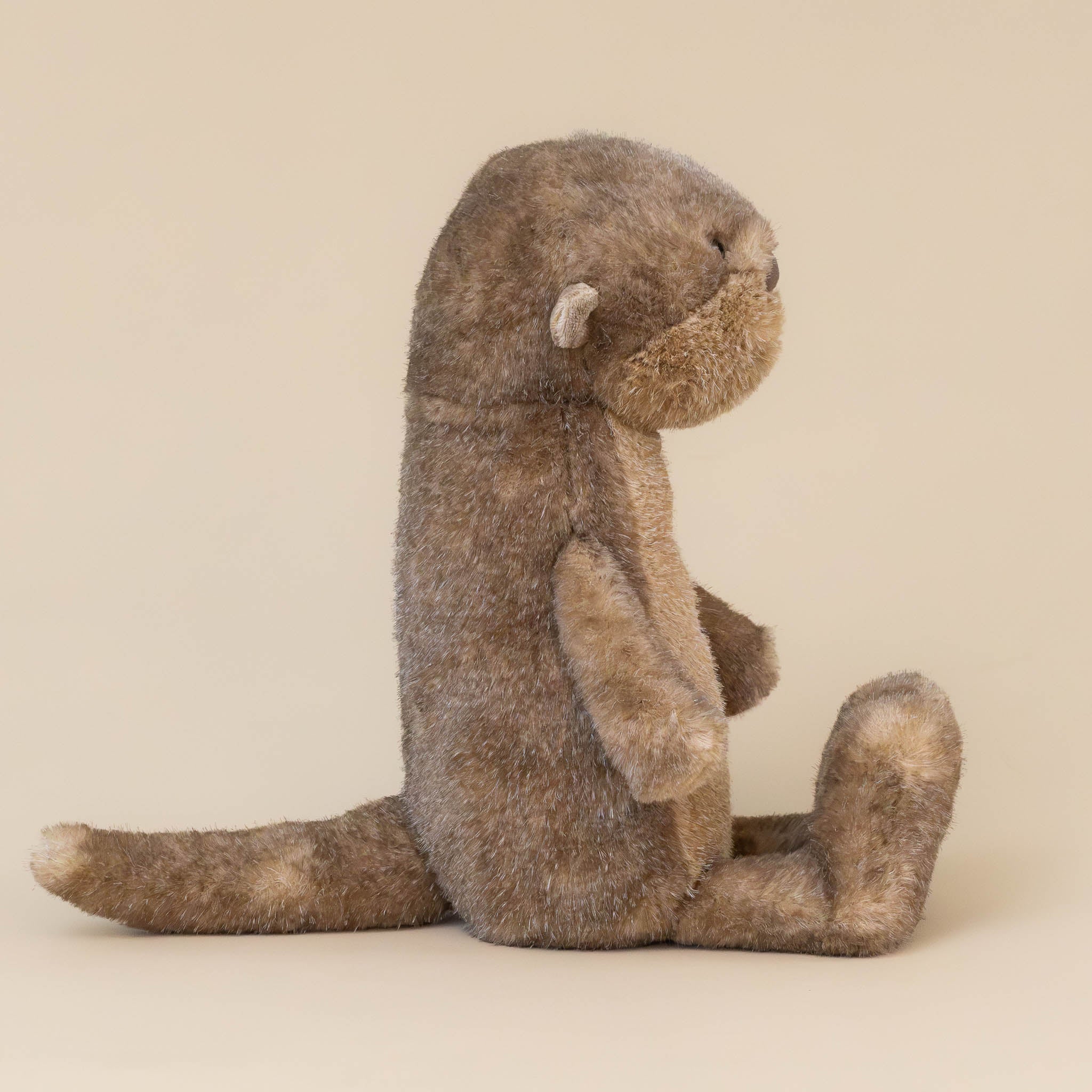 brooke-otter-brown-stuffed-animal-side-with-small-ears-long-tail-and-long-feet