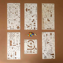 Load image into Gallery viewer, build-your-own-marble-run-tiered-hoist-6-cutout-sheet-wood-pieces-and-handful-of-marbles-rubber-band-and-weight--showing-all-kit-pieces