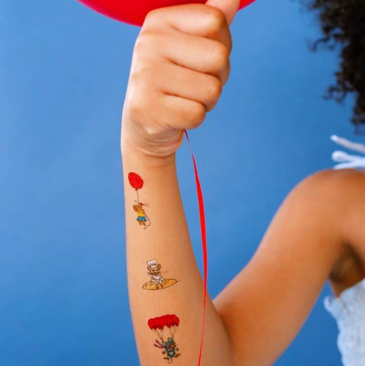 busy-world-mice-temporary-tattoo-sheet  of mouse with a red balloon, a chef, and a superhero on a child's arm against a blue background.