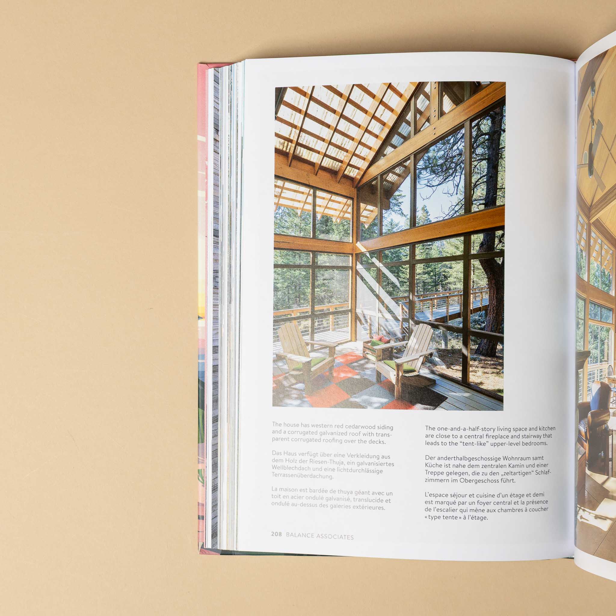 cabins Open book showing a interior design spread with a modern home.