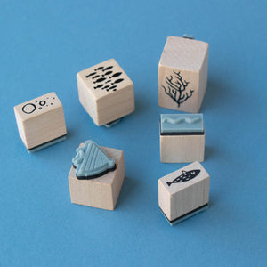 calm-stamps-under-the-sea-box-with-bubbles-waves-fish-and-coral-stamps
