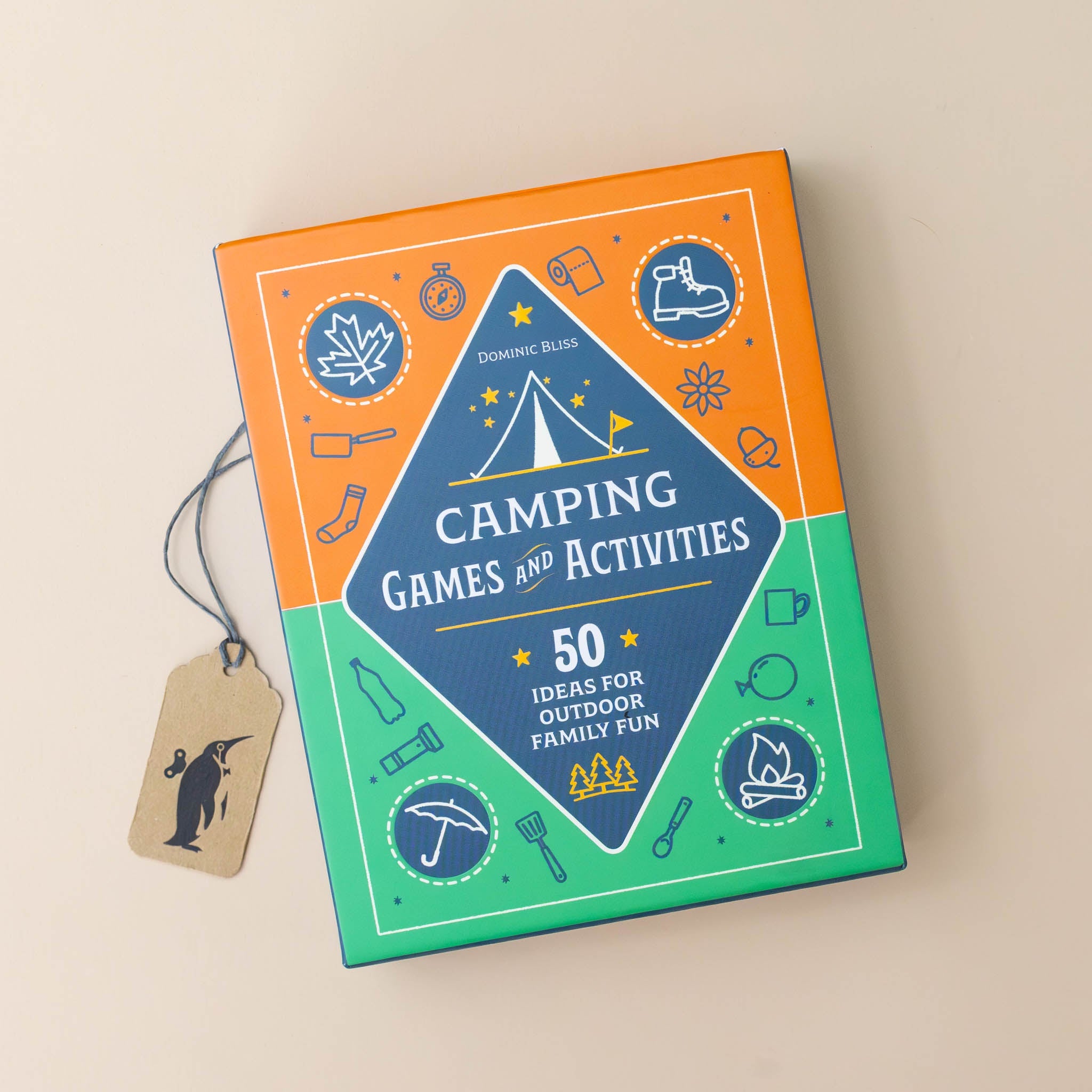 camping-games-and-activities-green-and-orange-box-with-black-diamond-in-the-middle-with-hiking-boot-umbrella-campfire-and-leaves