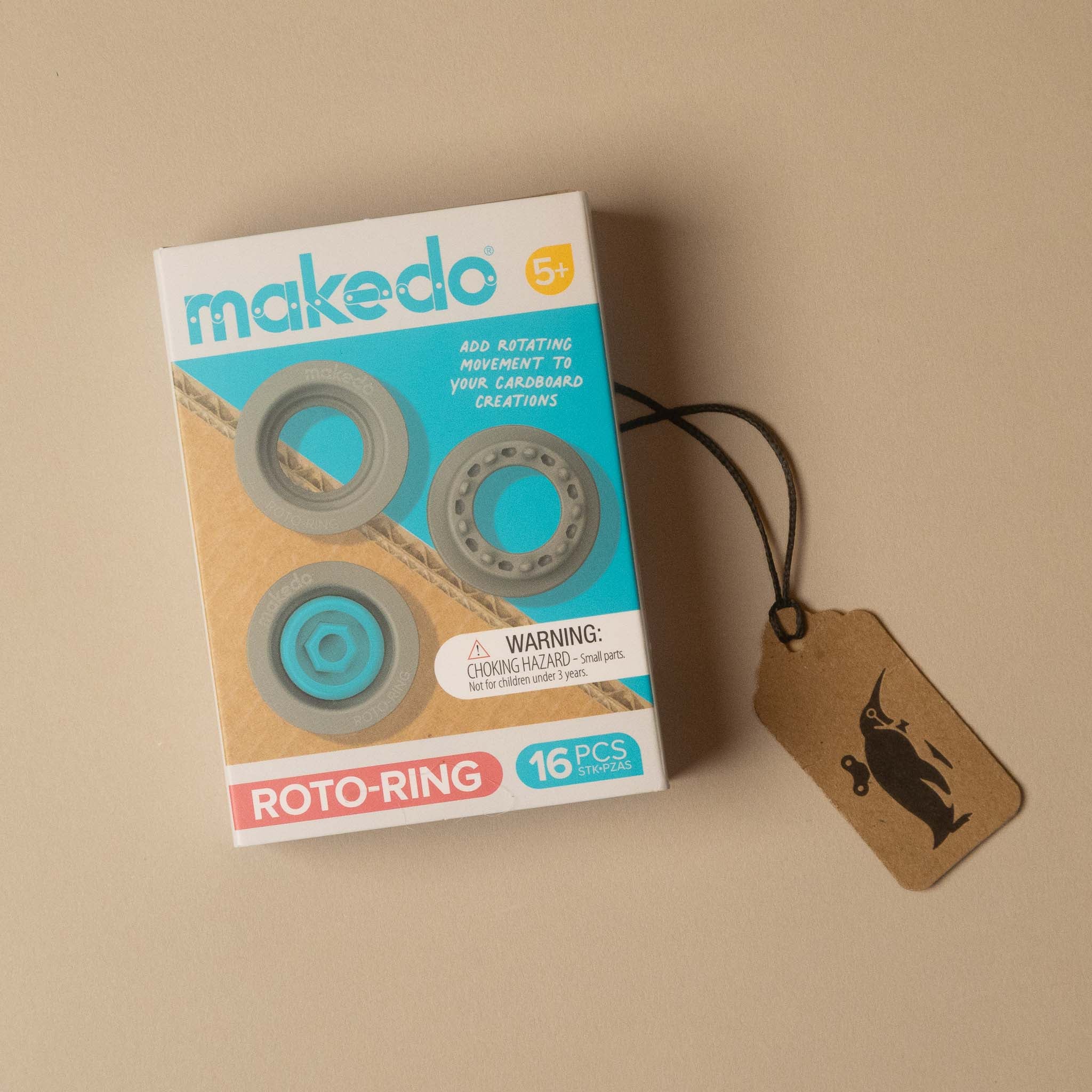 Makedo Roto-Ring 16-piece set in its original packaging, displayed on a beige background next to a brown kraft paper hangtag.