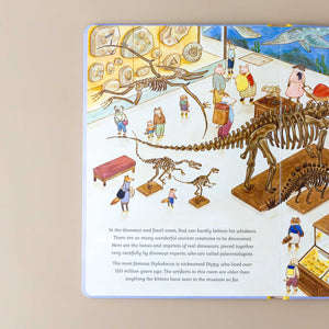 interior-page-of-cat-family-near-many-dinosaur-skeletons-and-text