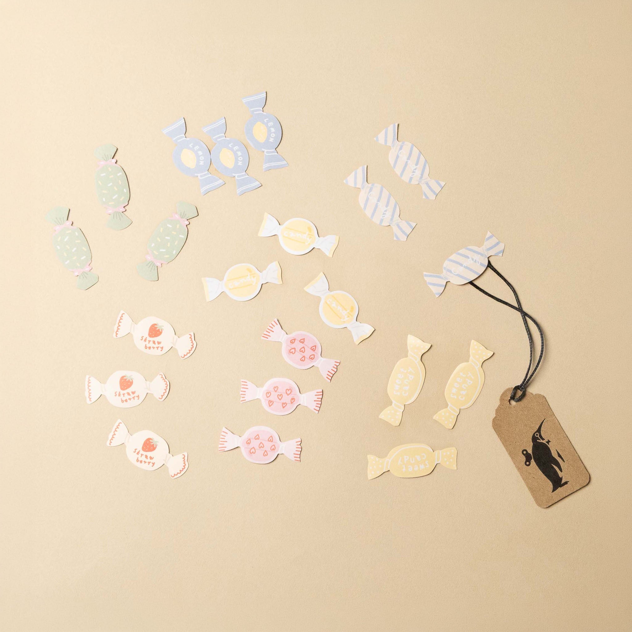 Decorative candy stickers with a tag on a beige background