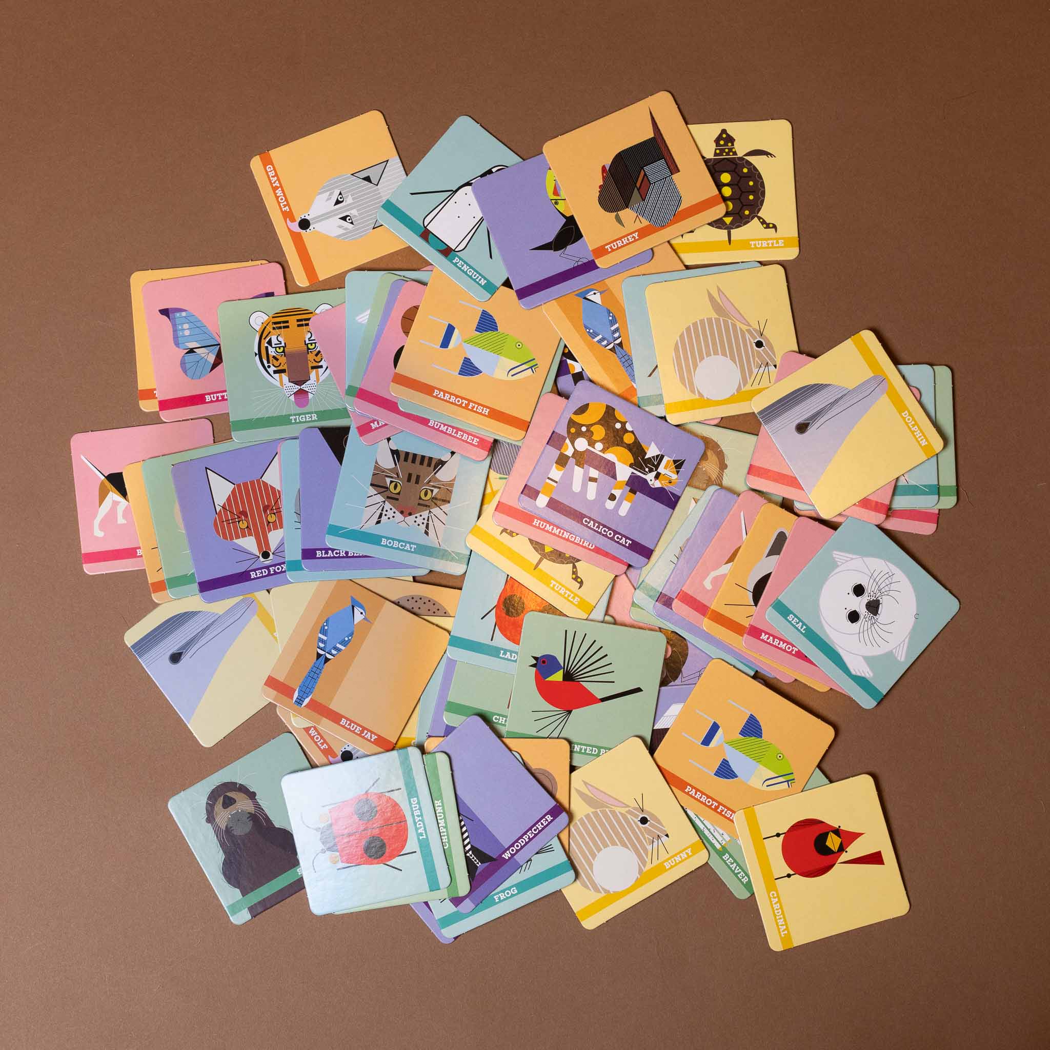 charlie-harpers-animal-memory-game Collection of colorful children's flashcards on a brown background