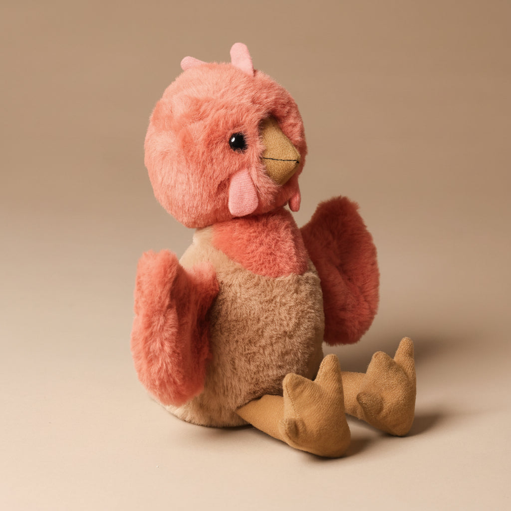 Plush toy clucky-chicken-marmalade  on a beige background