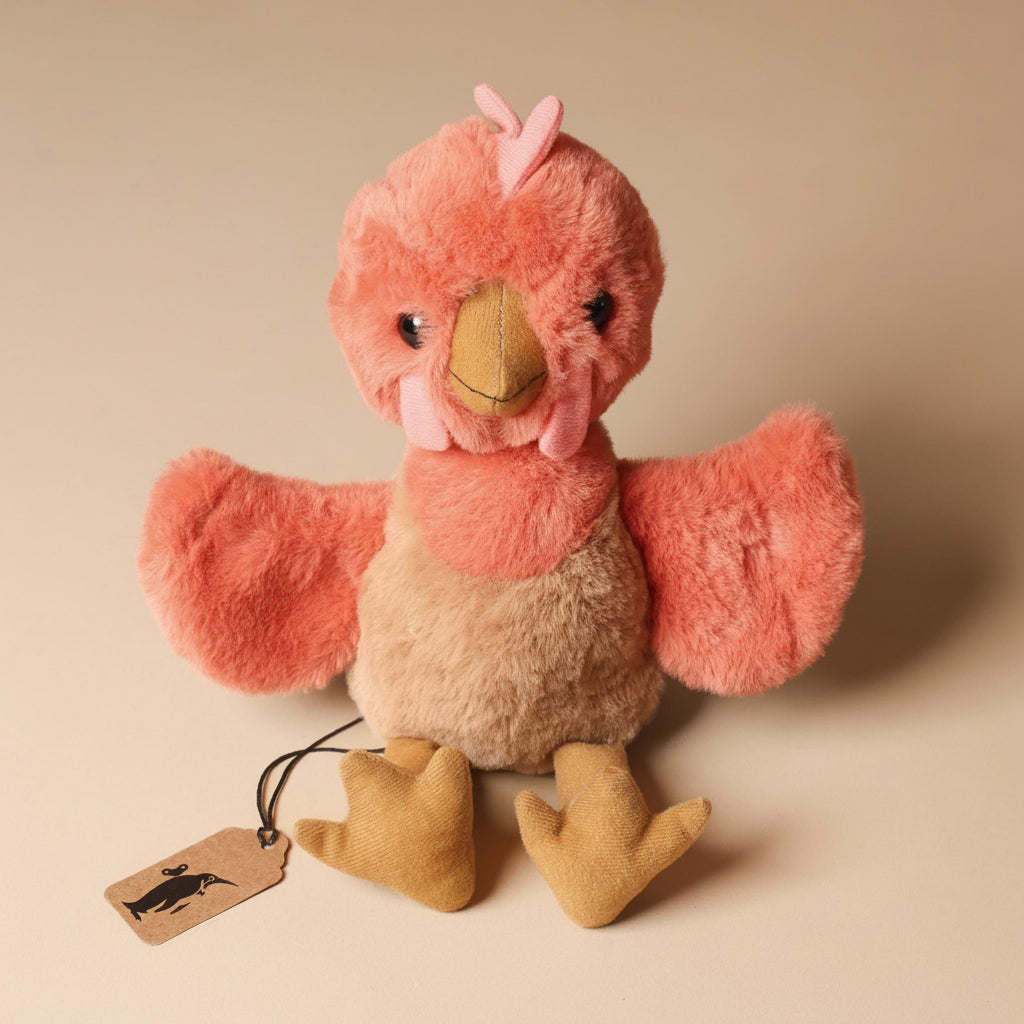 Plush toy clucky-chicken-marmalade  on a beige background