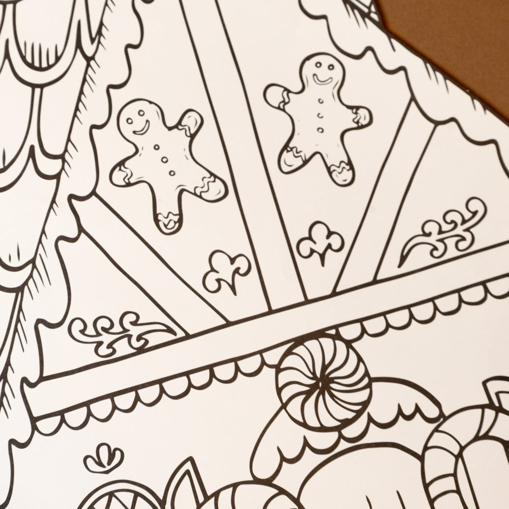color-your-own-gingerbread-house-placemat-set Gingerbread house coloring page with gingerbread men and candy decorations.