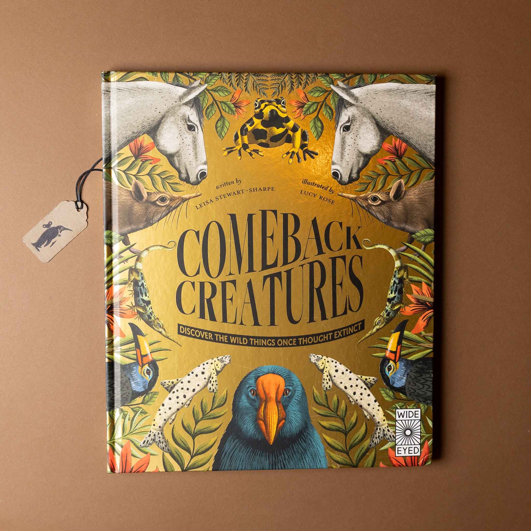 Book titled 'Comeback Creatures' on a brown background
