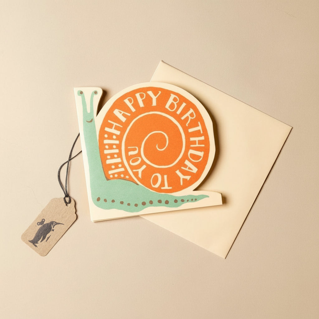 concertina-greeting-card--birthday-snail with snail design and 'Happy Birthday' text on a beige background