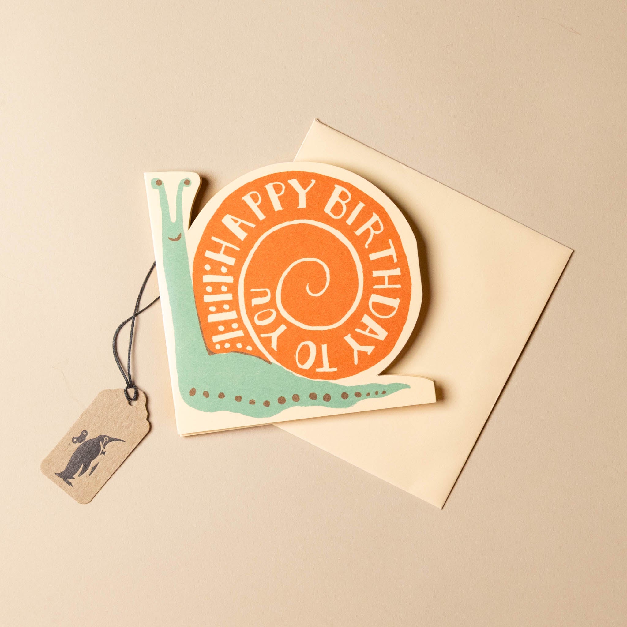 concertina-greeting-card--birthday-snail with snail design and 'Happy Birthday' text on a beige background