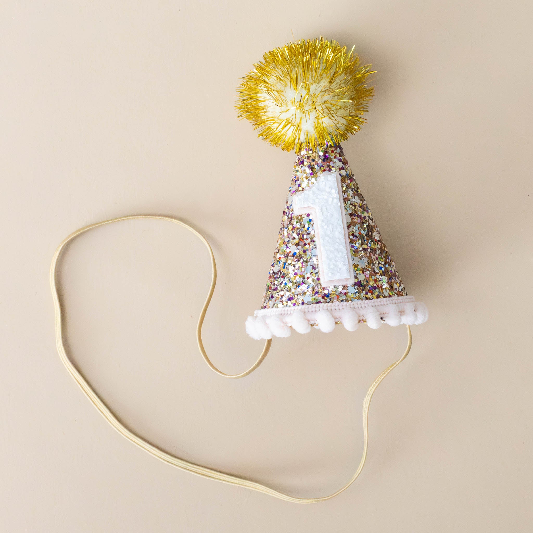 confetti-pom-party-hat-blush-and-gold-with-strap